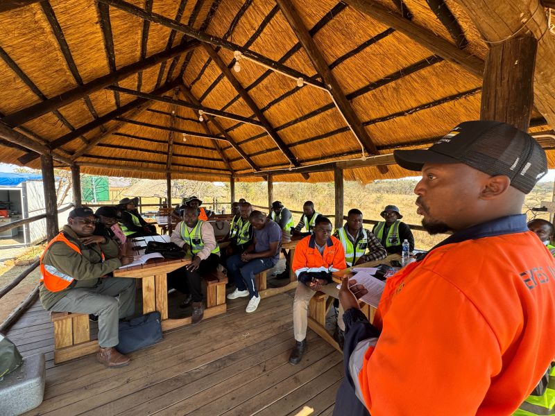 Drone pilots receiving a pre-flight safety briefing