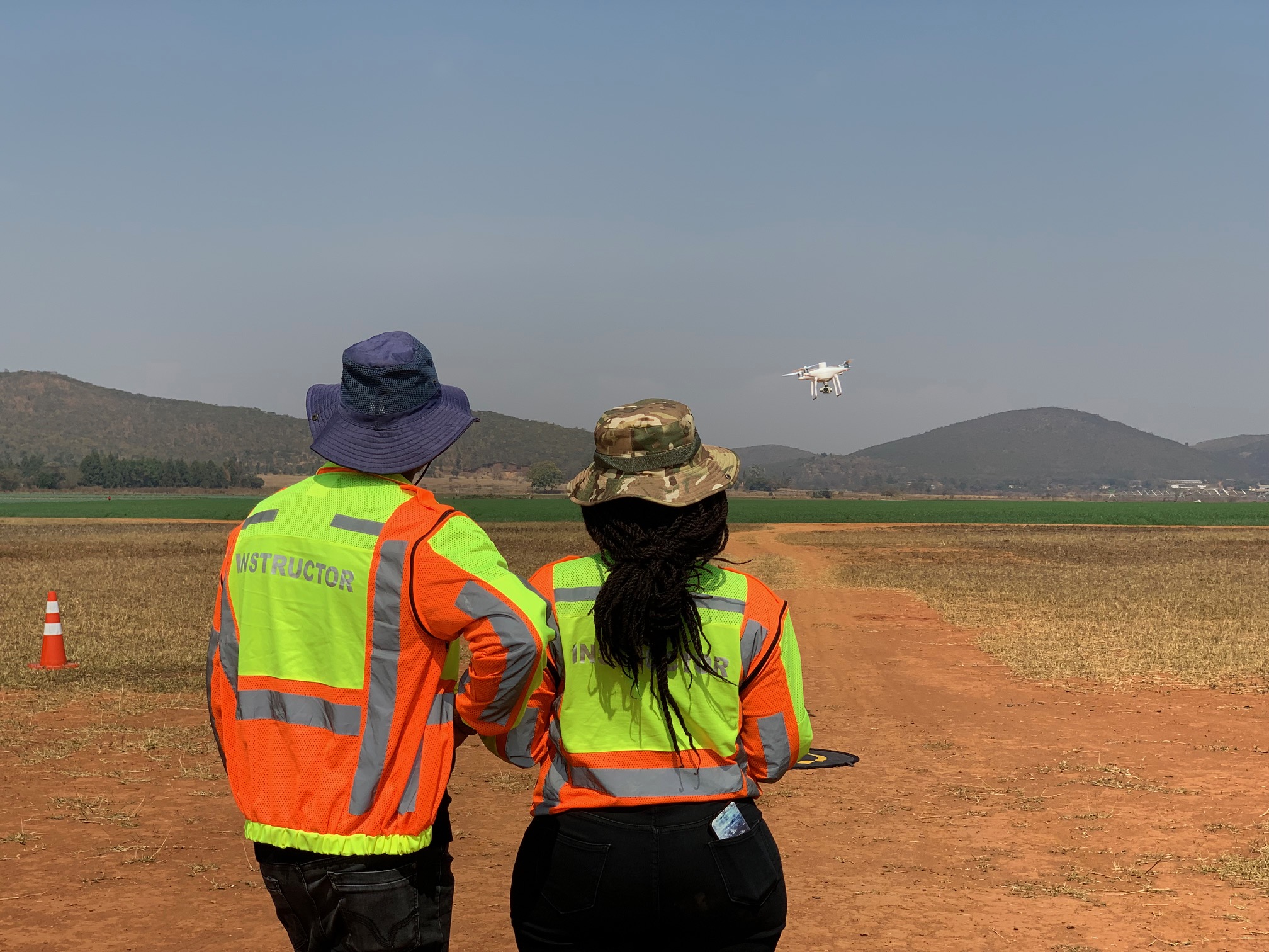 Drone University instructor and trainee conducting practical flight training